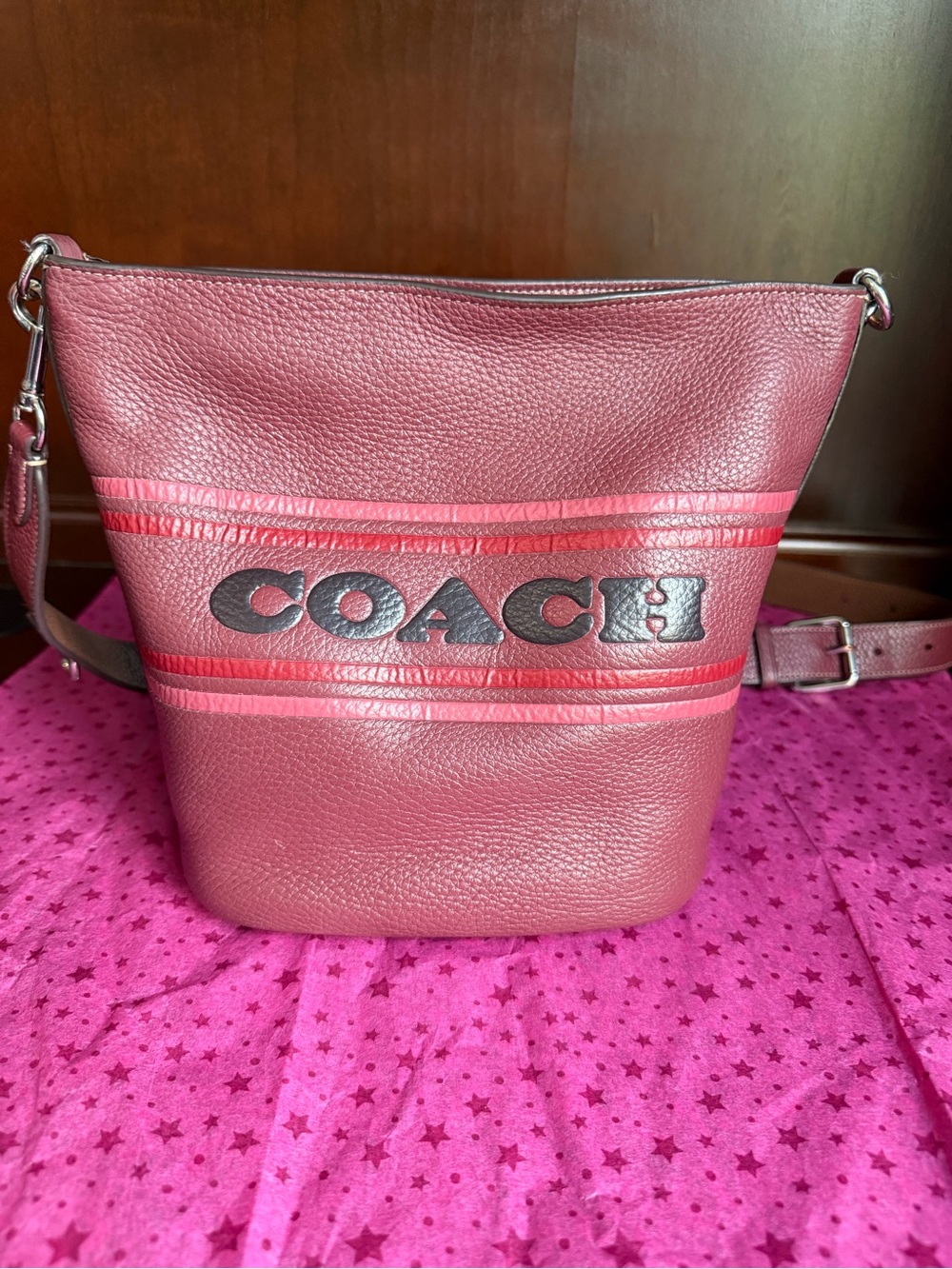 Coach Logan Duffle With Coach Stripe in wine multi